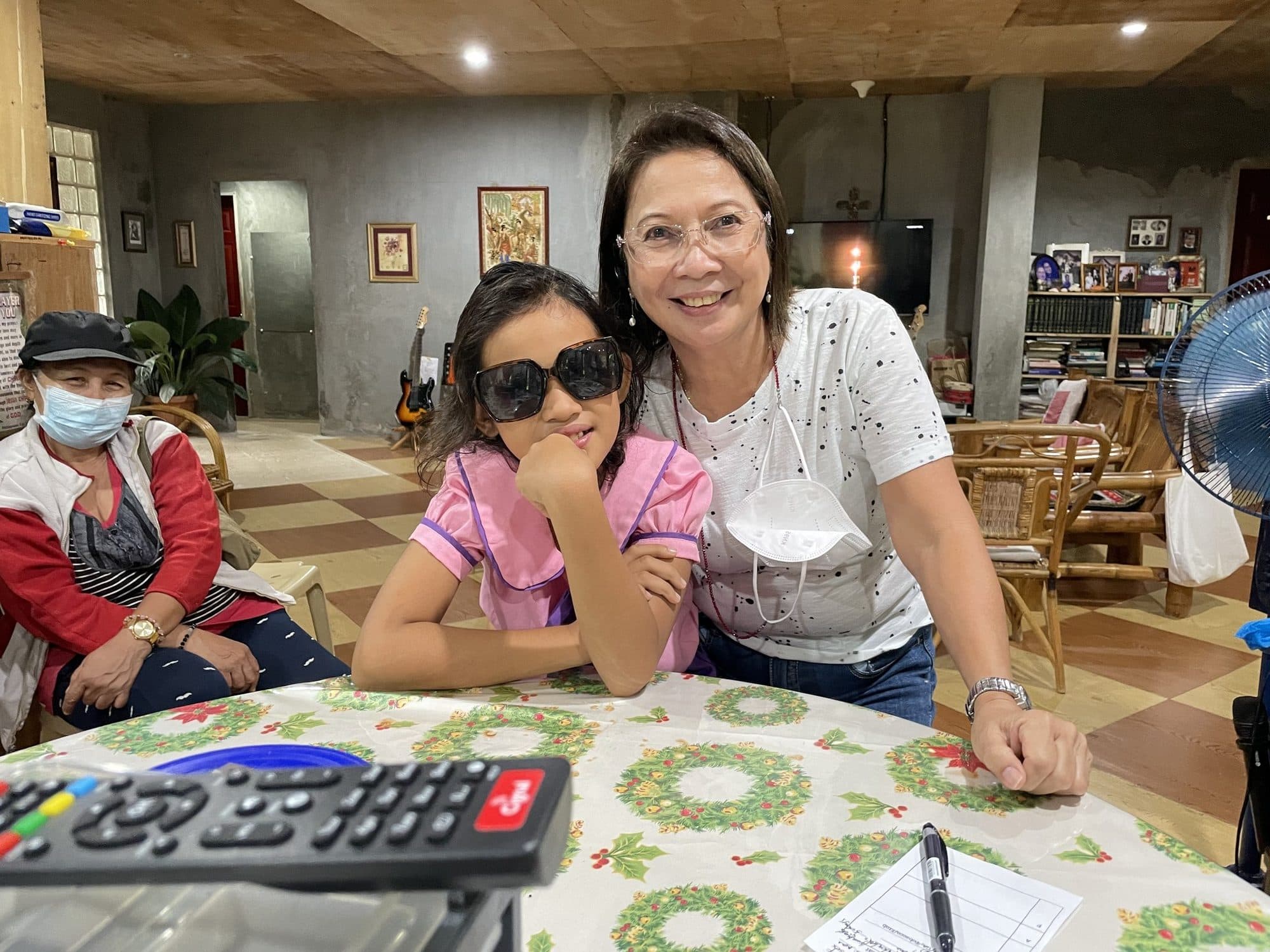 Rhome Nuttall and a young patient smile at the clinic